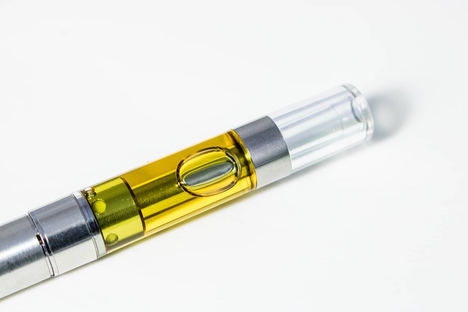 Full gram cartridge of cannabis oil extract and terpenes. Marijuana vape pen is an alternative method of smoking and consuming  marijuana.